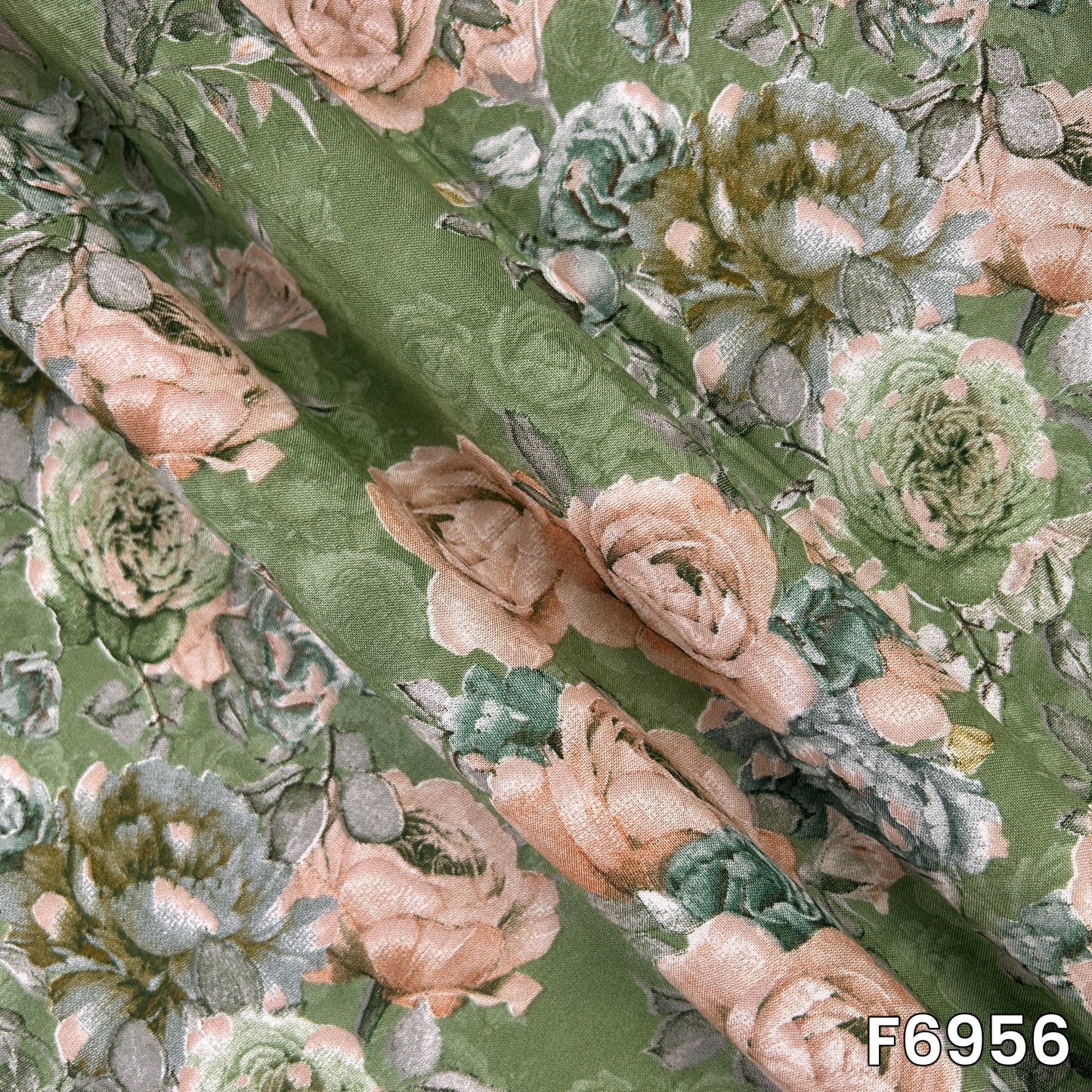 Draped F6956 material revealing fluid folds, smooth texture and a refined antique-inspired flower print