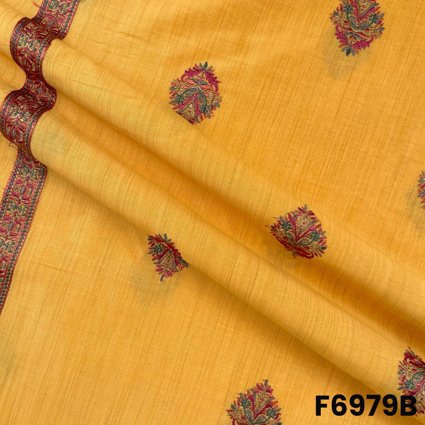 Draped F6979B fabric highlighting rich yellow tone, embroidered buta work and graceful semi silk texture