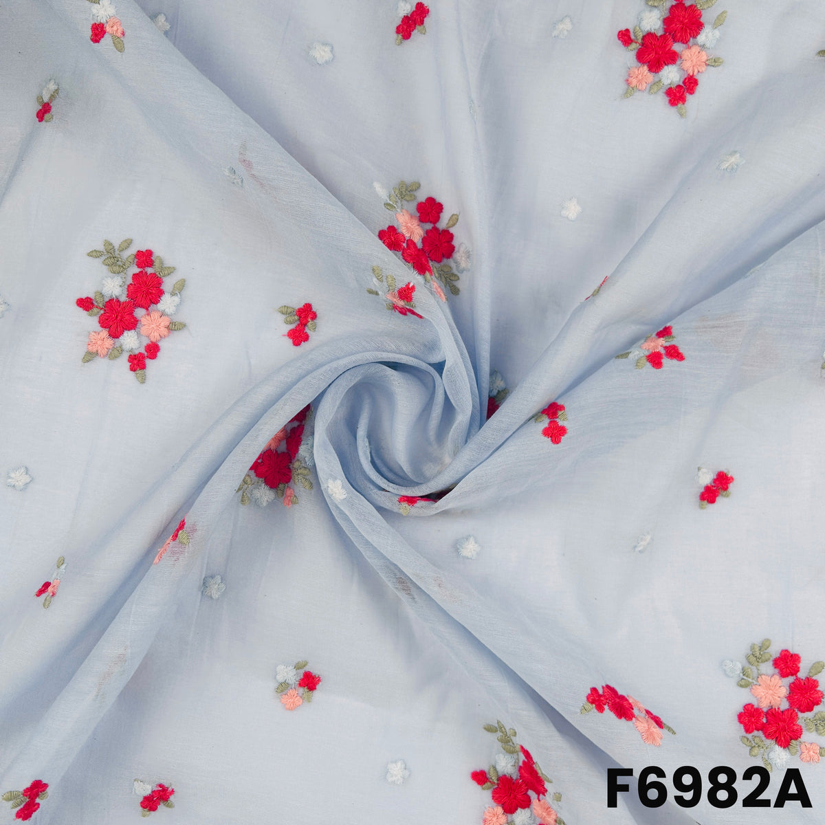 Close view of F6982A showing fine flower placement, light fabric texture and graceful embroidered details