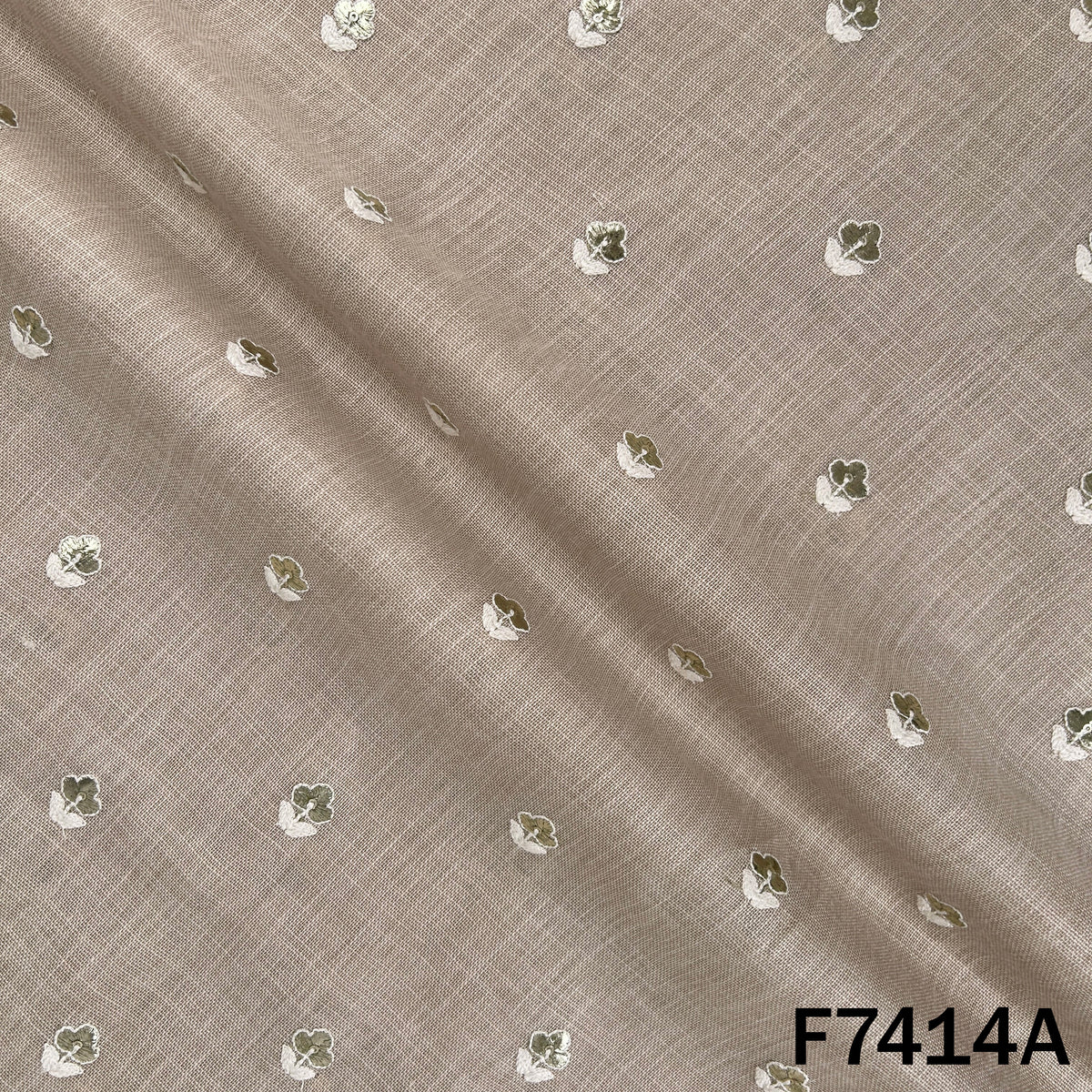 Beige designer linen fabric with scattered zari motifs