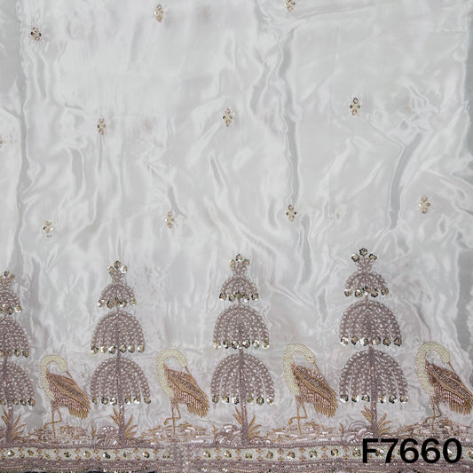 Ivory crepe fabric with intricate golden ornamental zari border