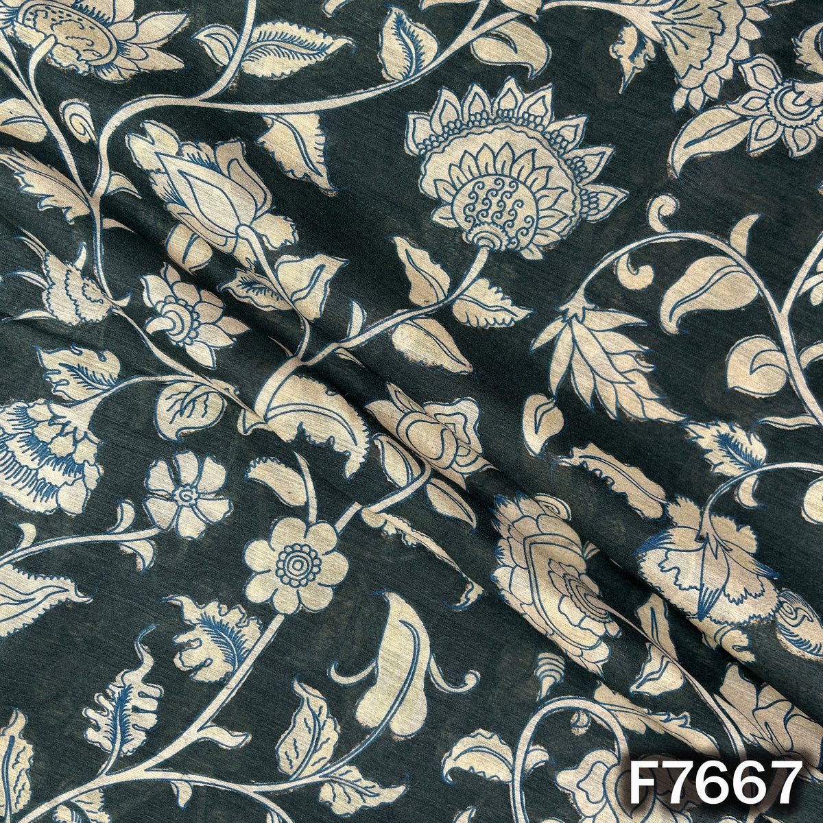 Draped dark green Pure Monga silk fabric with elegant floral vine print