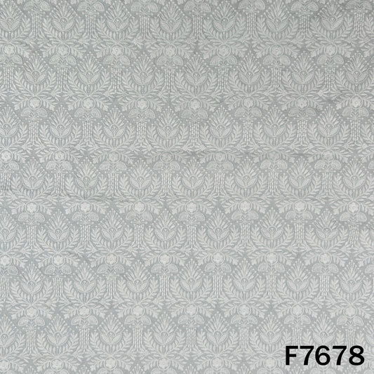 Ivory raw silk fabric with intricate tone-on-tone floral motifs