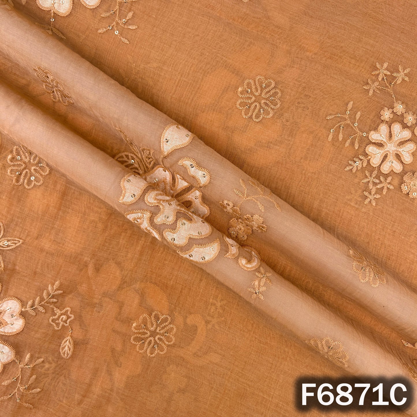 Close-up of orange Mul Chanderi fabric F6871C showing elegant thread sequins design