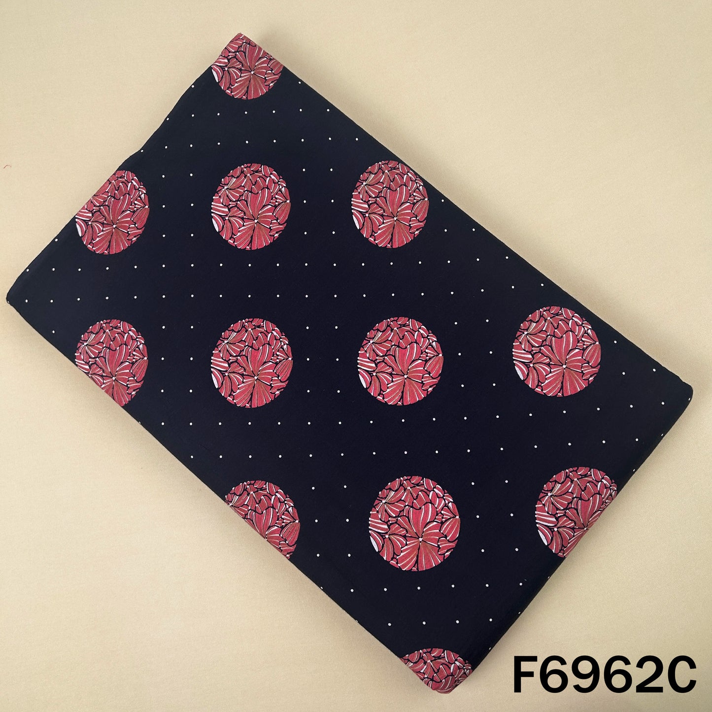 Black cotton fabric F6962C with contrast pink circular motifs and minimal dotted background detailing