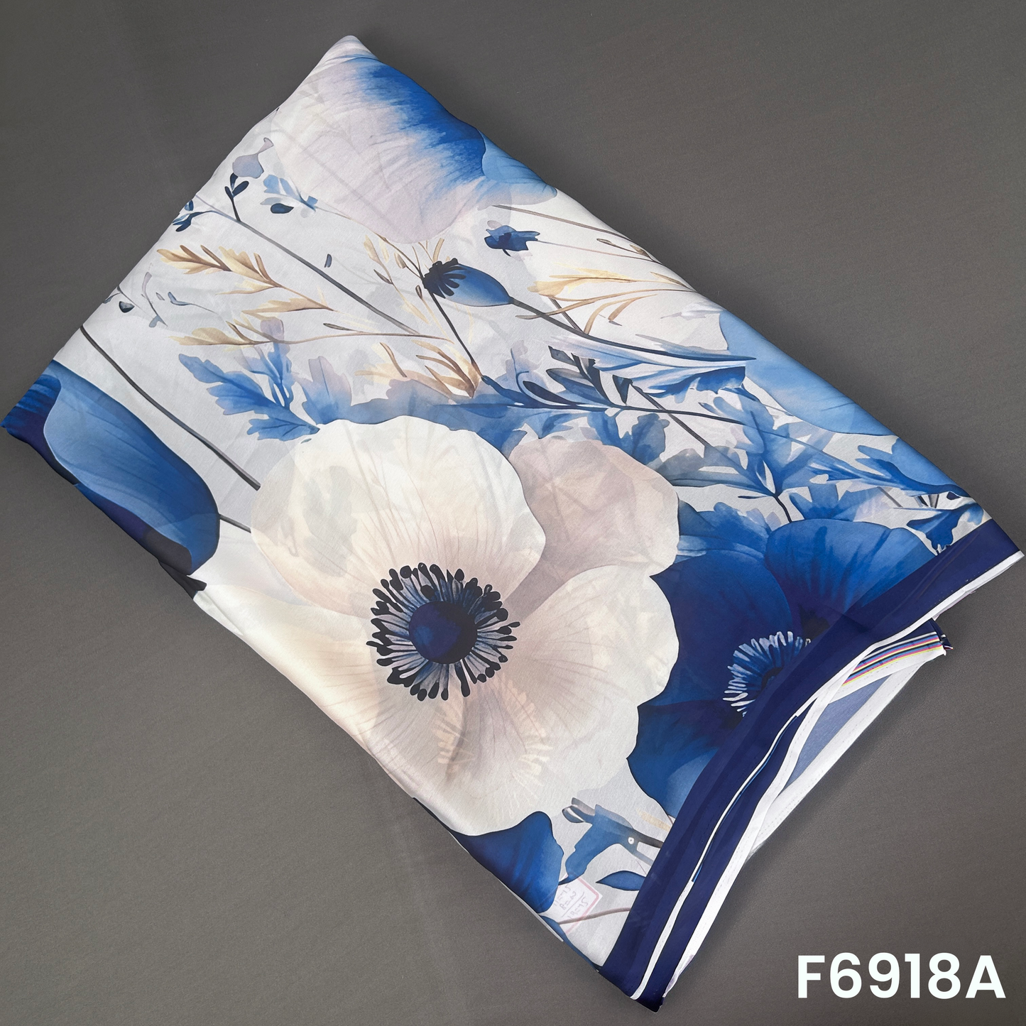 F6918A Crepe Satin fabric featuring large watercolor-style flowers with soft blue shading