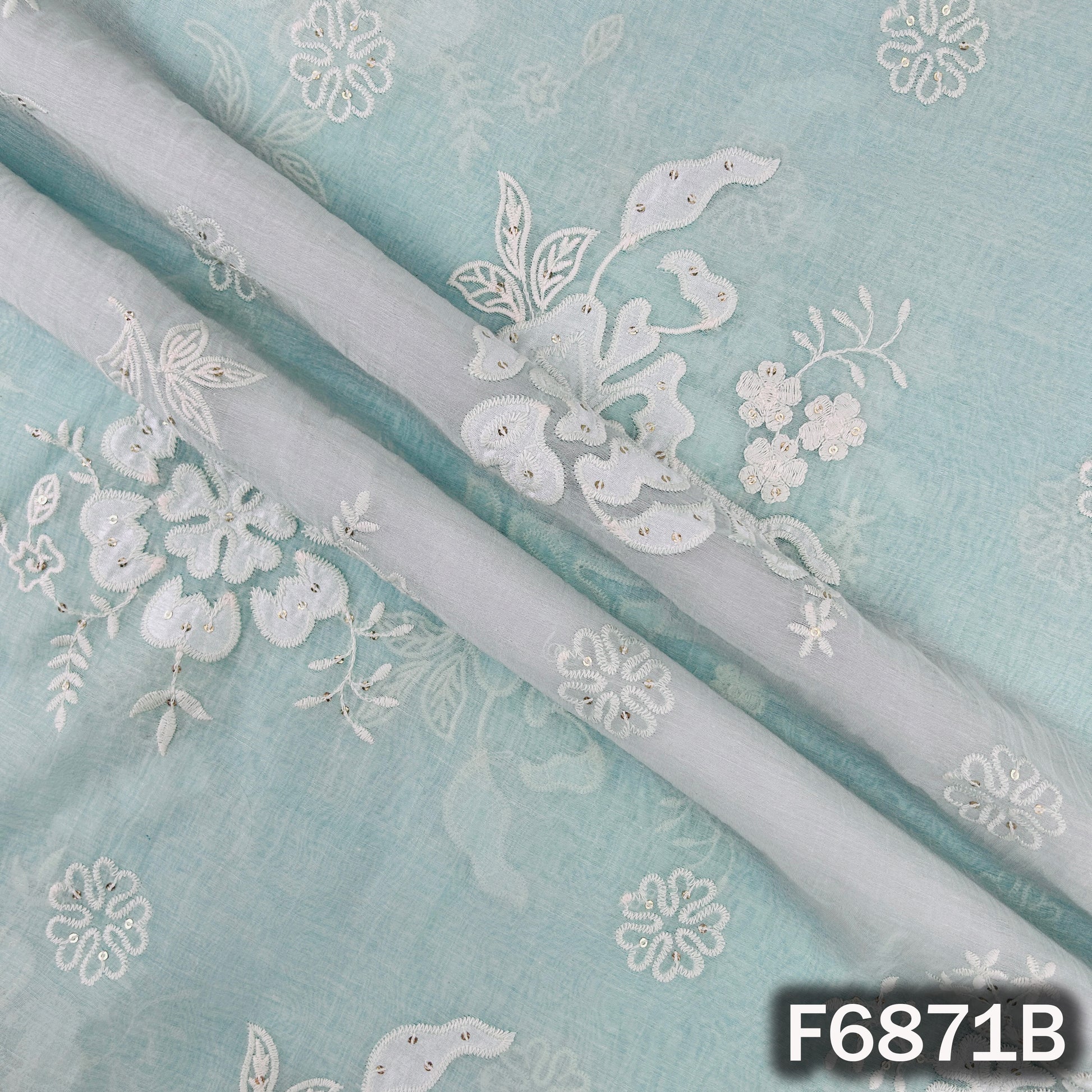 Detailed view of blue Mul Chanderi fabric F6871B with thread sequins work