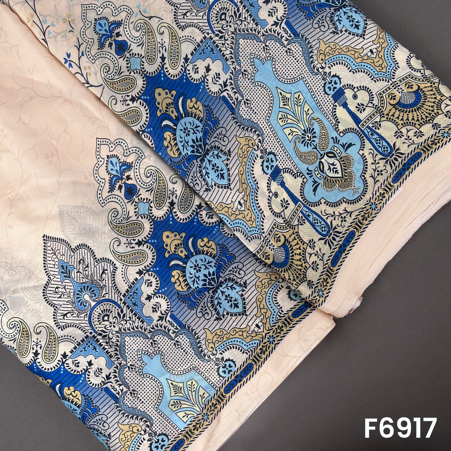 Beige Crepe Satin fabric F6917 with blue paisley floral artwork and elegant ethnic border styling