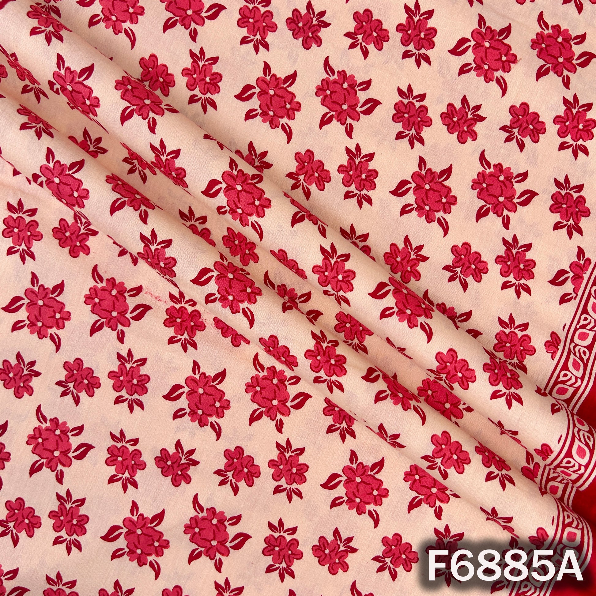 Close-up of F6885A red cotton fabric showing neat flower print and smooth breathable texture