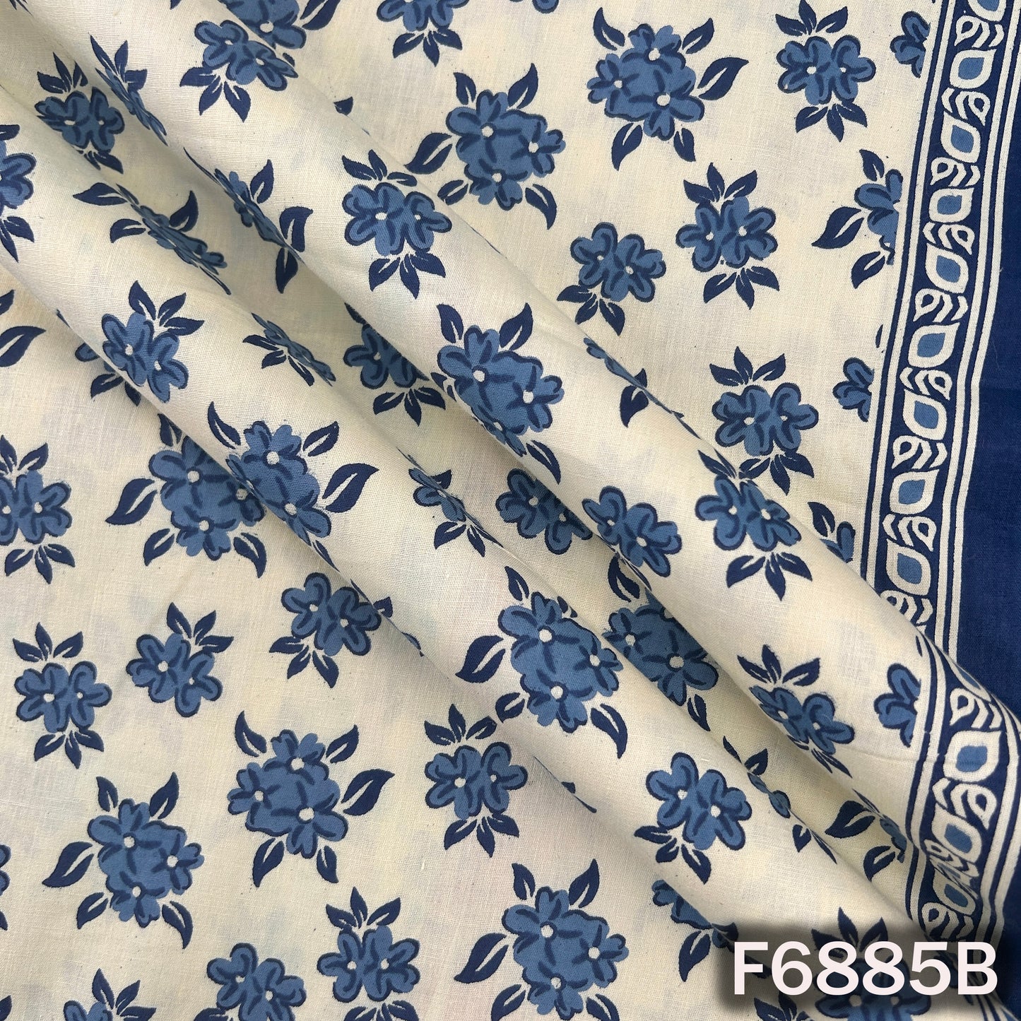Detailed blue cotton fabric F6885B highlighting crisp floral artwork with a clean printed finish
