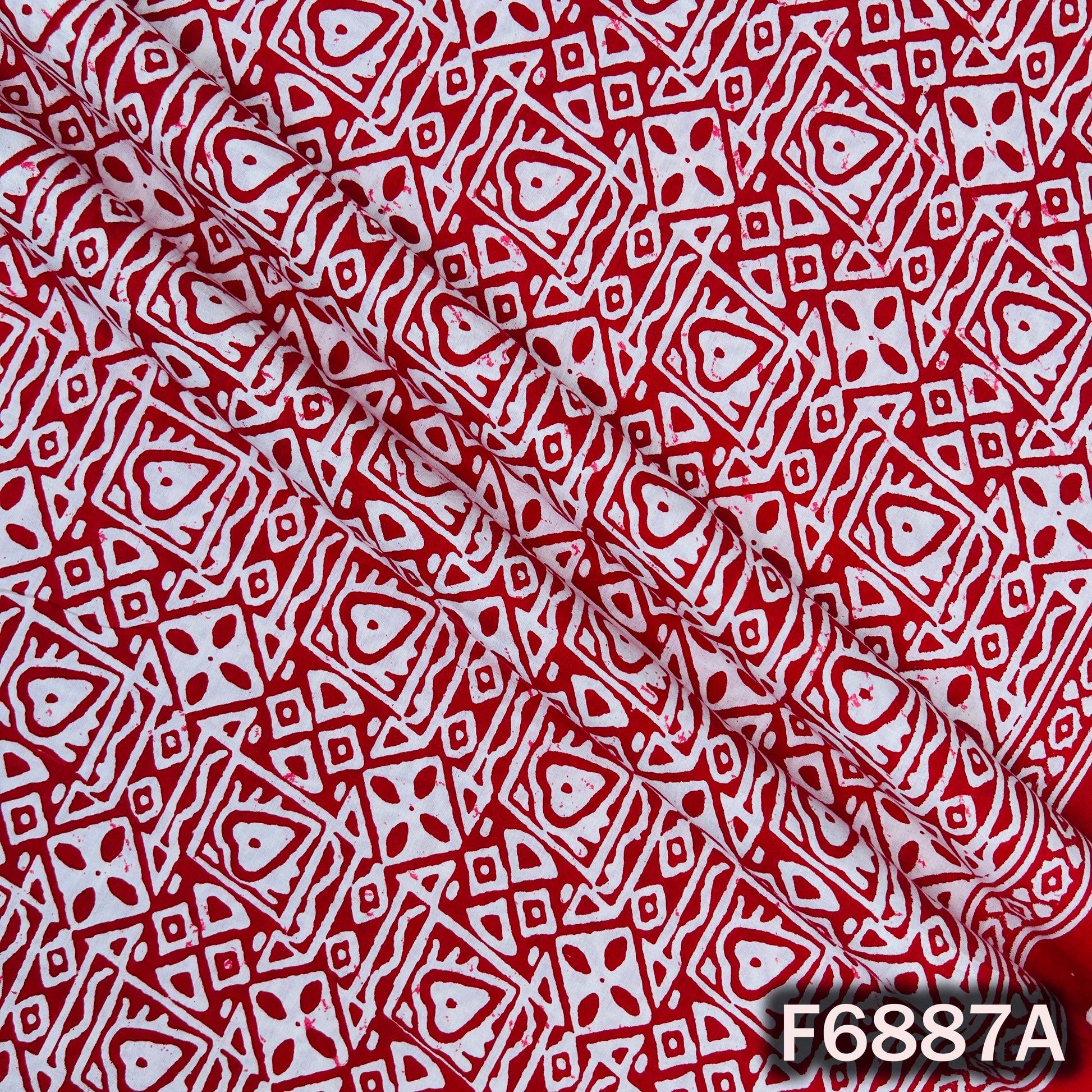 Close-up of F6887A red cotton fabric showing sharp block print artwork and neat printed texture