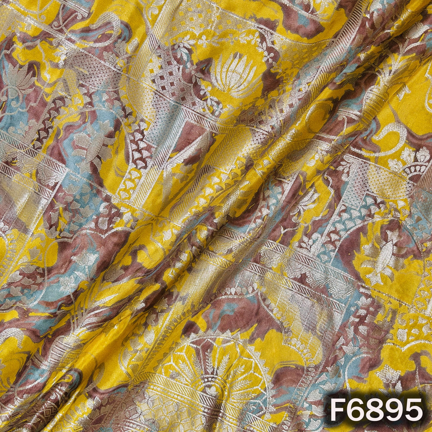 Draped view of shimmer tissue fabric F6895 highlighting its glossy texture and premium festive finish