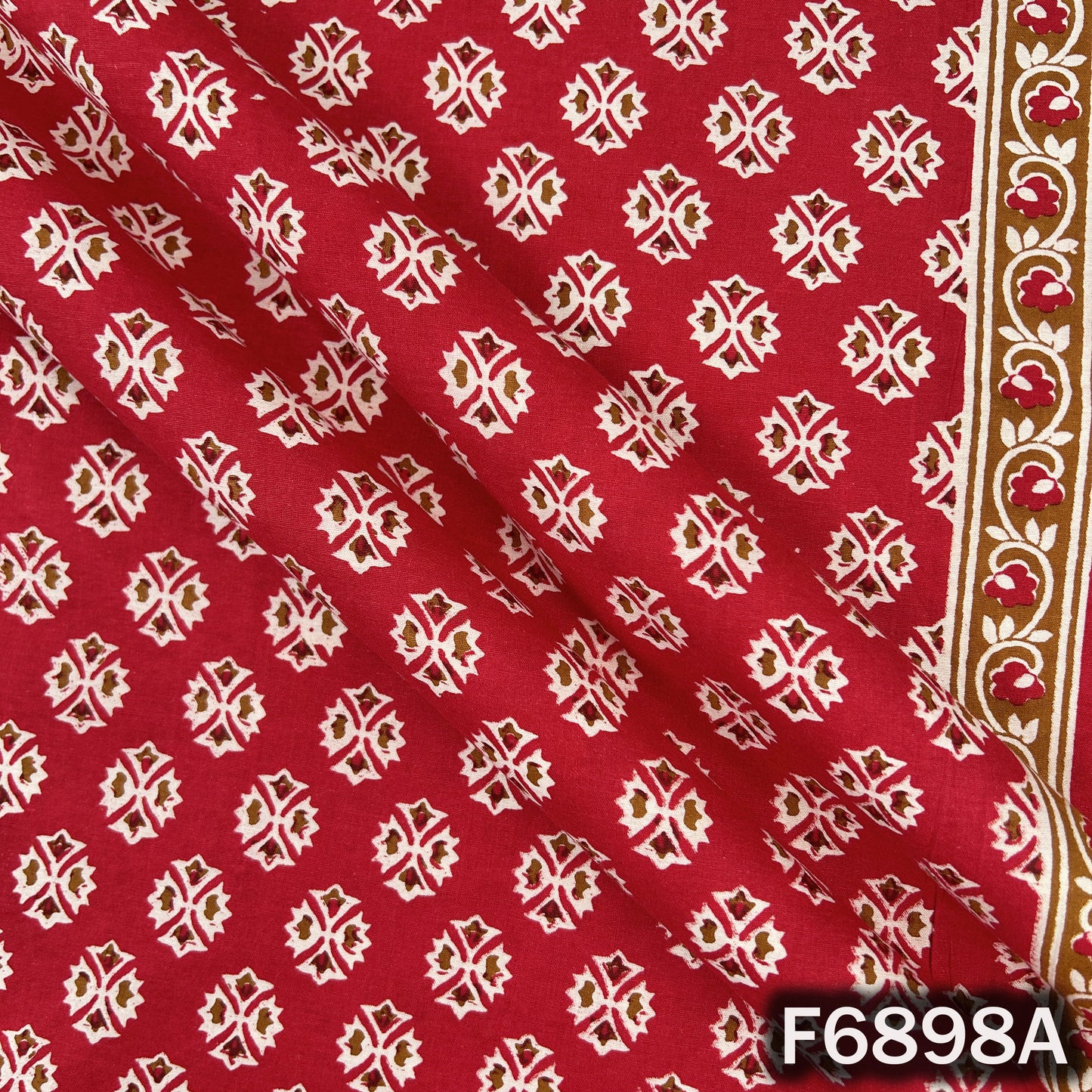 Close-up of F6898A red cotton fabric showing neat block print artwork and clear surface texture