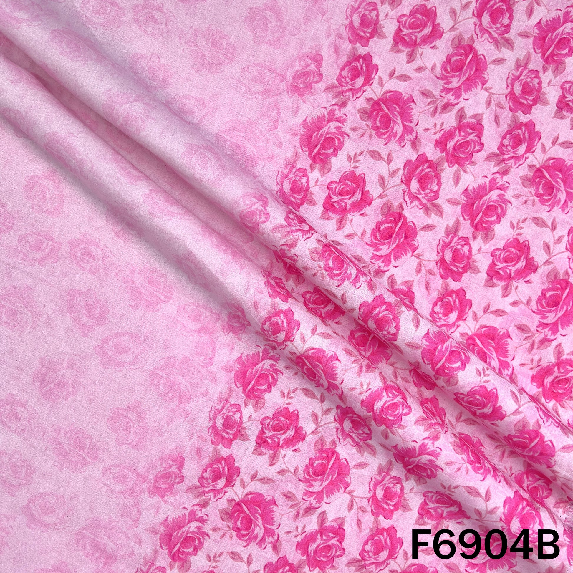 Close inspection of F6904B showing a soft blush base, delicate woven finish and understated printed elements