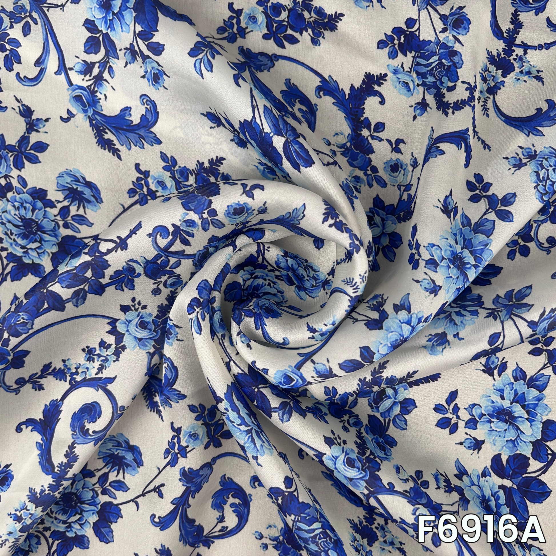 Close view of F6916A showing detailed floral vines, border accents and polished satin texture