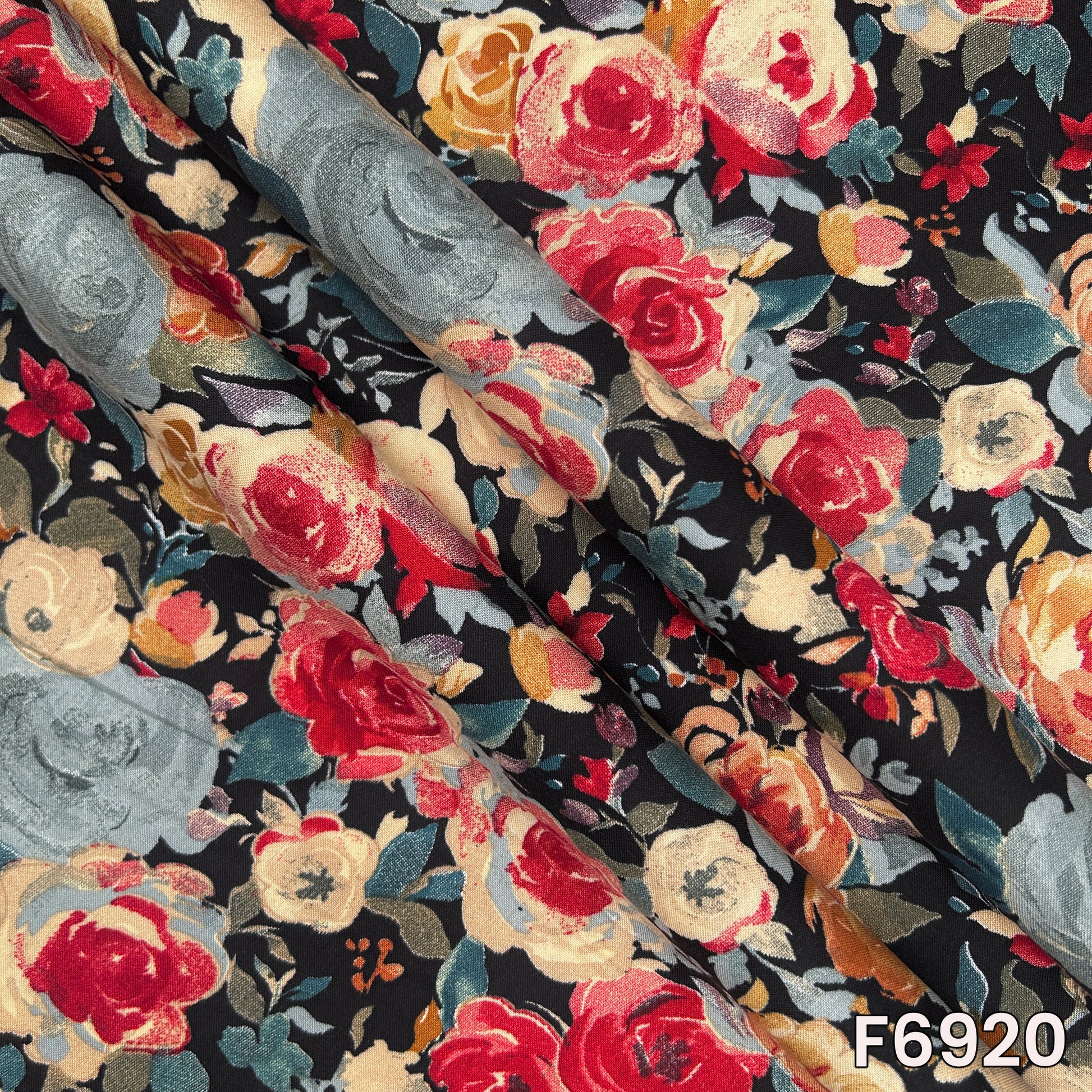 Draped F6920 rayon fabric highlighting smooth fall, lightweight texture and vibrant floral print placement