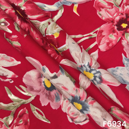 Close folded view of F6934 rayon fabric showing smooth drape, glossy accents and elegant botanical placement