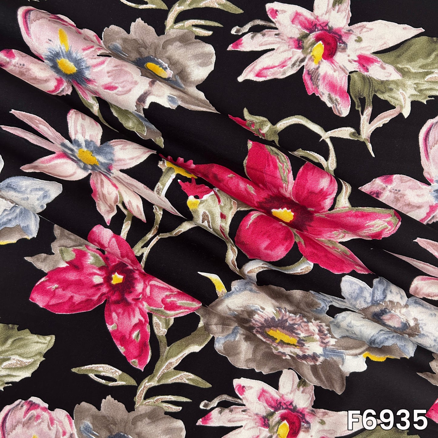 Draped F6935 rayon fabric highlighting smooth folds, lightweight flow and elegant metallic floral detailing