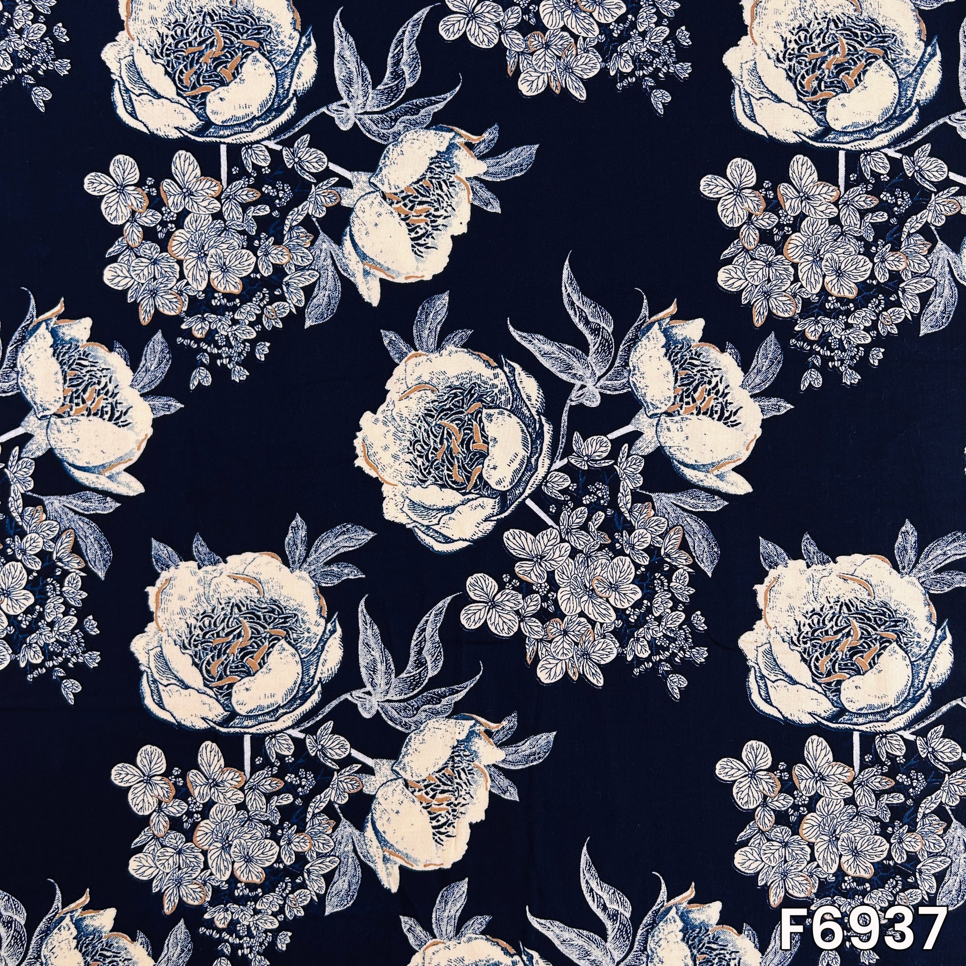 Close pattern view of F6937 showing large ivory blossoms, fine leafy branches and deep blue background contrast