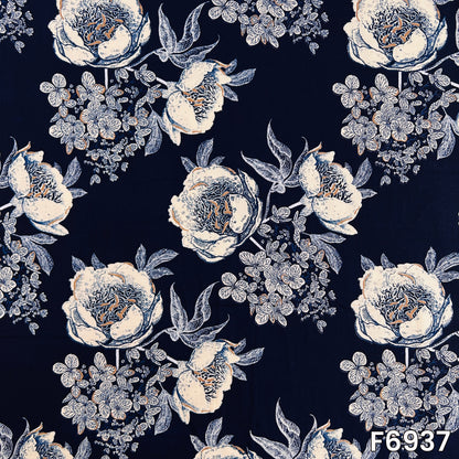 Close pattern view of F6937 showing large ivory blossoms, fine leafy branches and deep blue background contrast