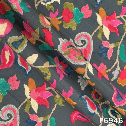 Draped rayon fabric F6946 displaying its fluid fall, smooth surface and richly layered botanical artwork