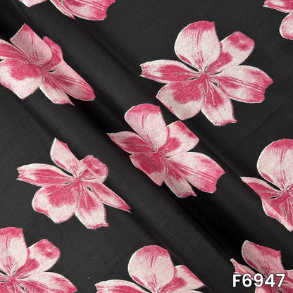 Draped rayon material F6947 revealing fluid folds, lightweight texture and clearly defined flower motifs