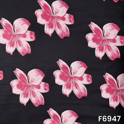 Full pattern view of F6947 showing soft pink blossoms with shaded petals against a classic black background