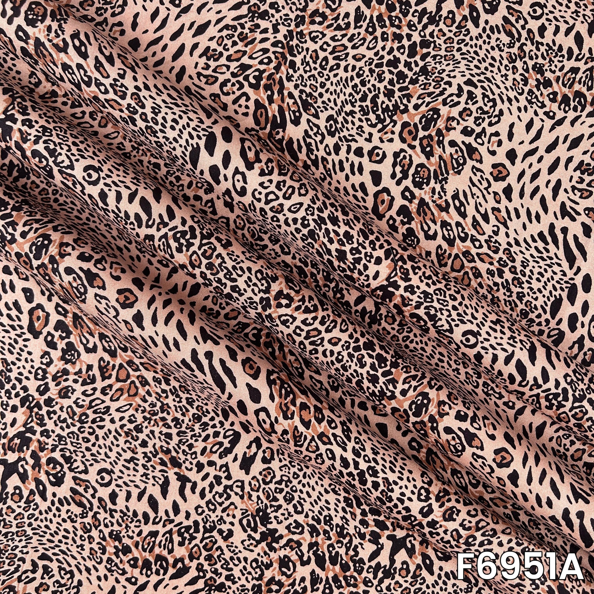 Detailed F6951A view revealing layered black markings, warm brown tones and a smooth woven surface