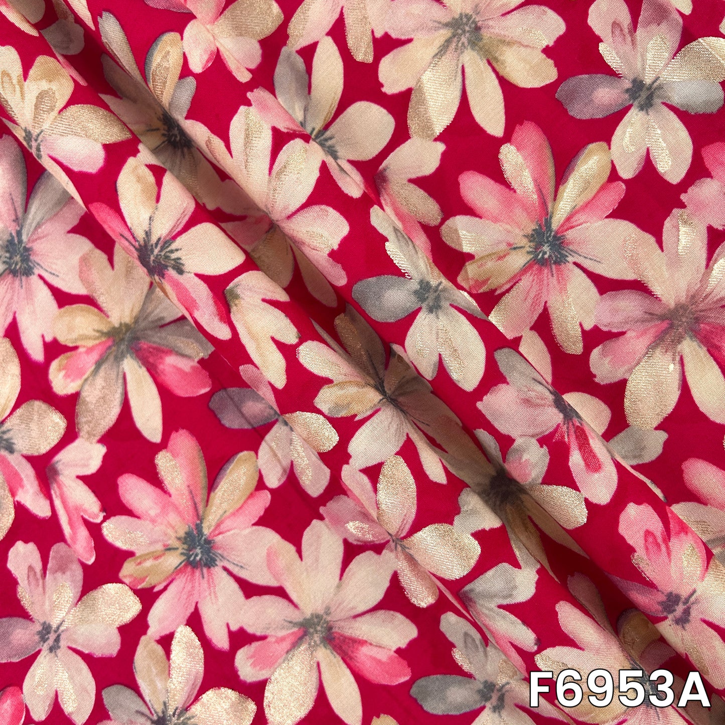 Close-range view of F6953A revealing layered petals, reflective accents and a smooth flowing surface