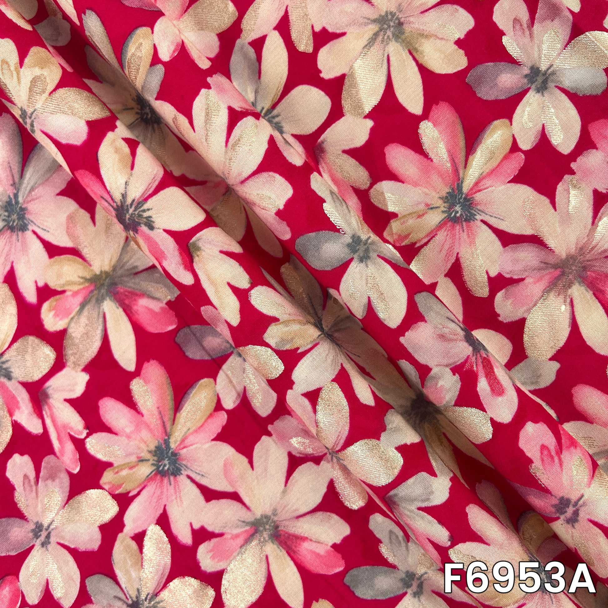 Close-range view of F6953A revealing layered petals, reflective accents and a smooth flowing surface