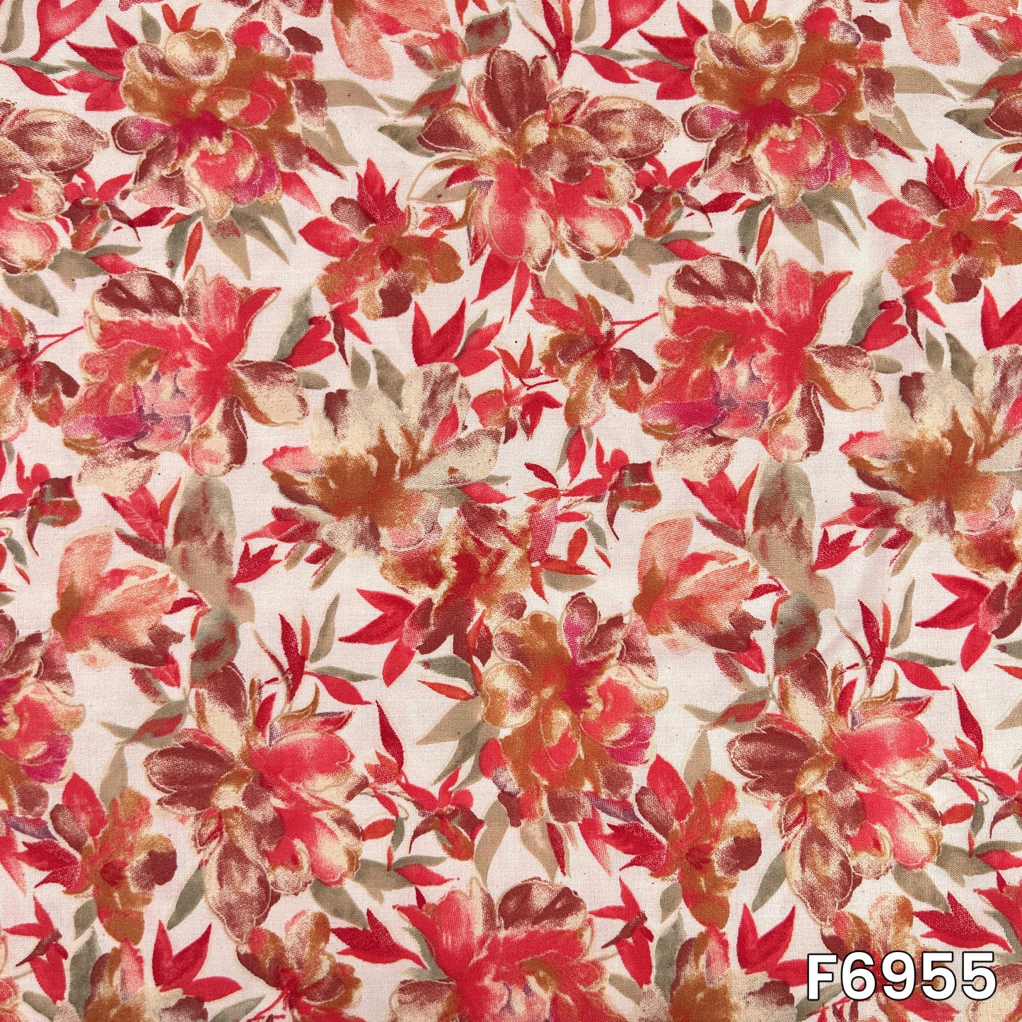 Detailed fabric view presenting scattered red blossoms, slender stems and earthy foliage across the pale rayon surface