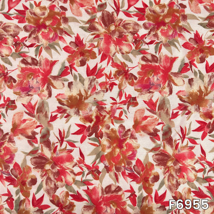 Detailed fabric view presenting scattered red blossoms, slender stems and earthy foliage across the pale rayon surface