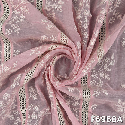 Close view of pink F6958A revealing fine thread embroidery, floral clusters and a softly textured woven base