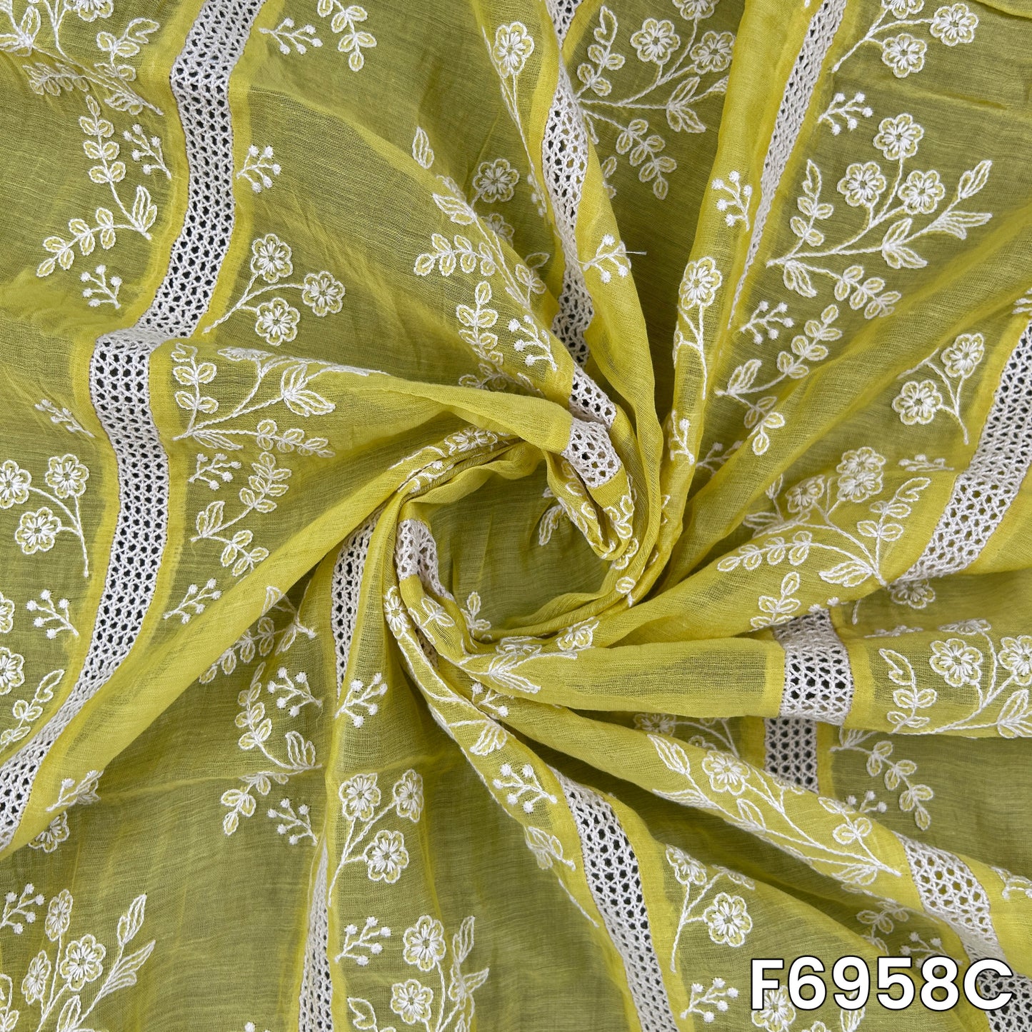 Detailed mustard F6958C fabric image showing crisp flower patterns, striped threadwork and graceful drape