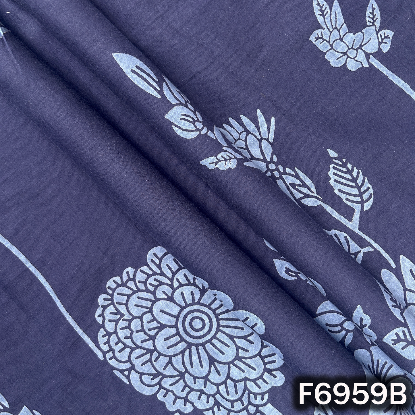 Detailed F6959B surface highlighting dark blue tone, clean floral artwork and breathable fabric finish