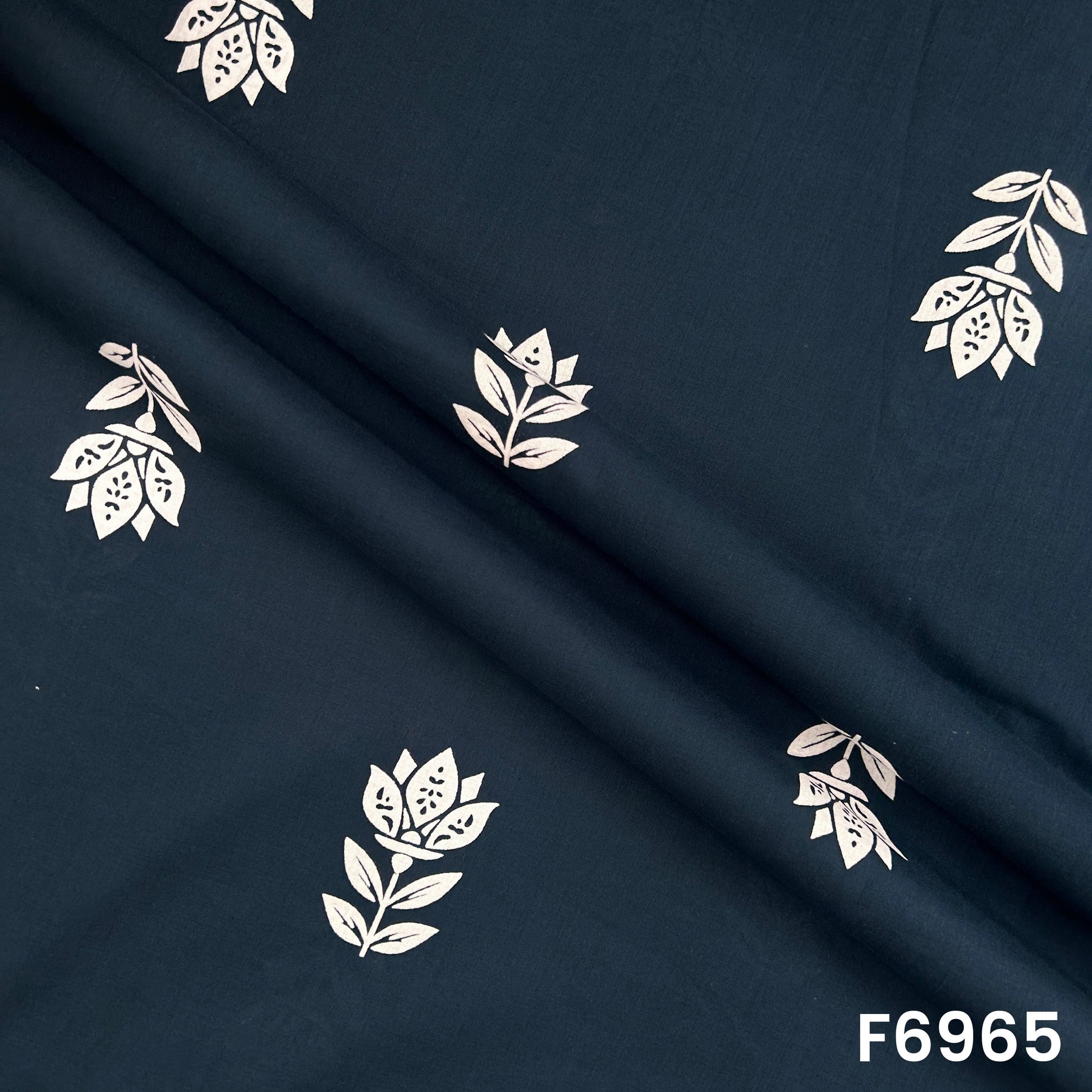 Draped F6965 cotton fabric highlighting soft folds, breathable feel and elegant minimal floral placement