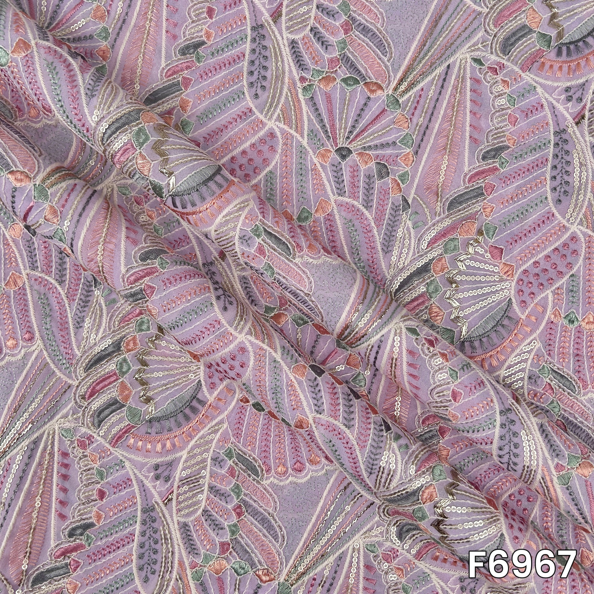 Draped F6967 Georgette fabric highlighting lightweight folds, pastel shimmer and elegant zari work finish
