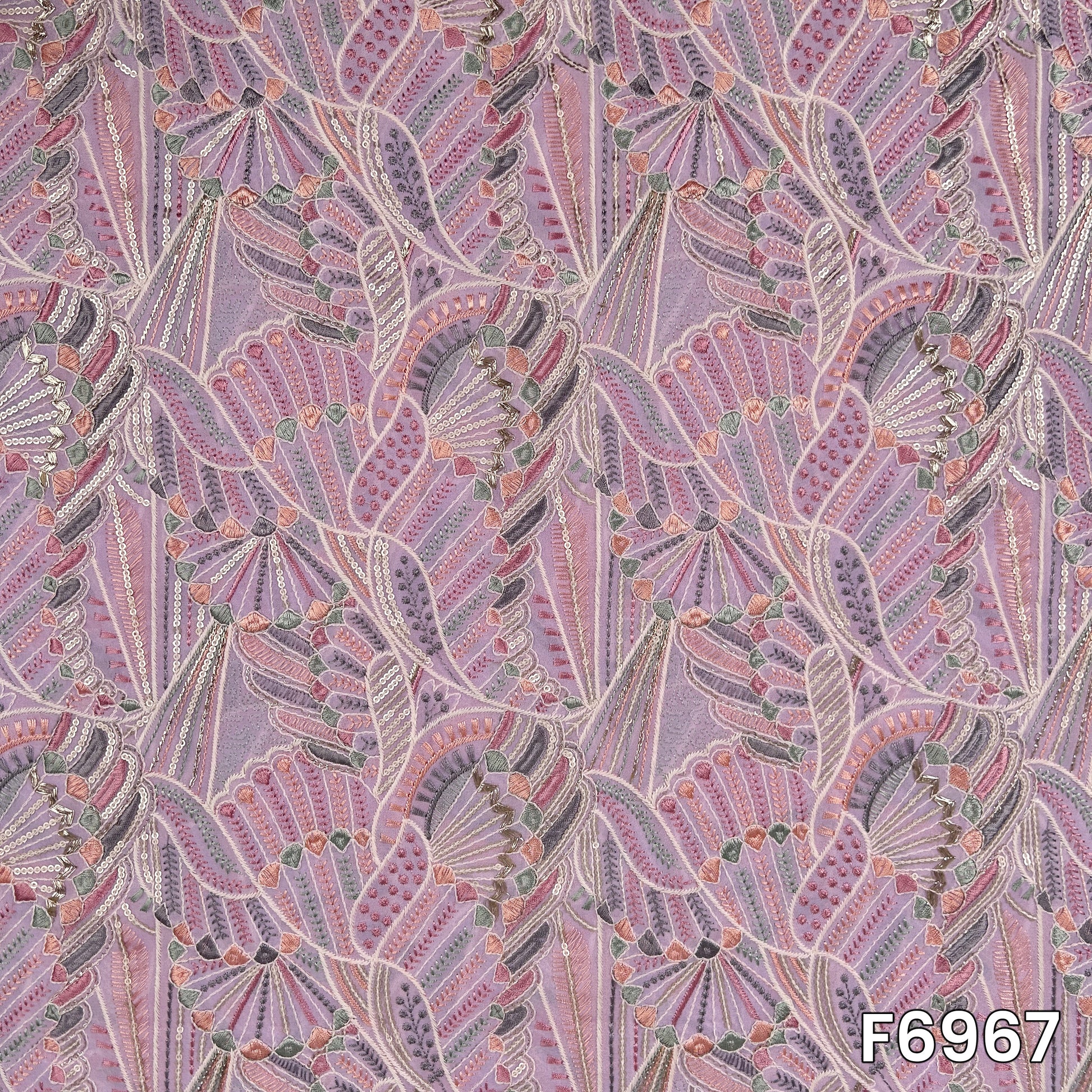 Close pattern view of F6967 showing intricate thread lines, sequins highlights and soft geometric embroidery