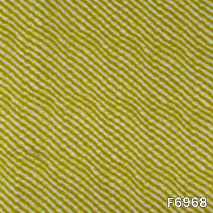 Close pattern view of F6968 showing fine white wavy lines across a bright mustard cotton base