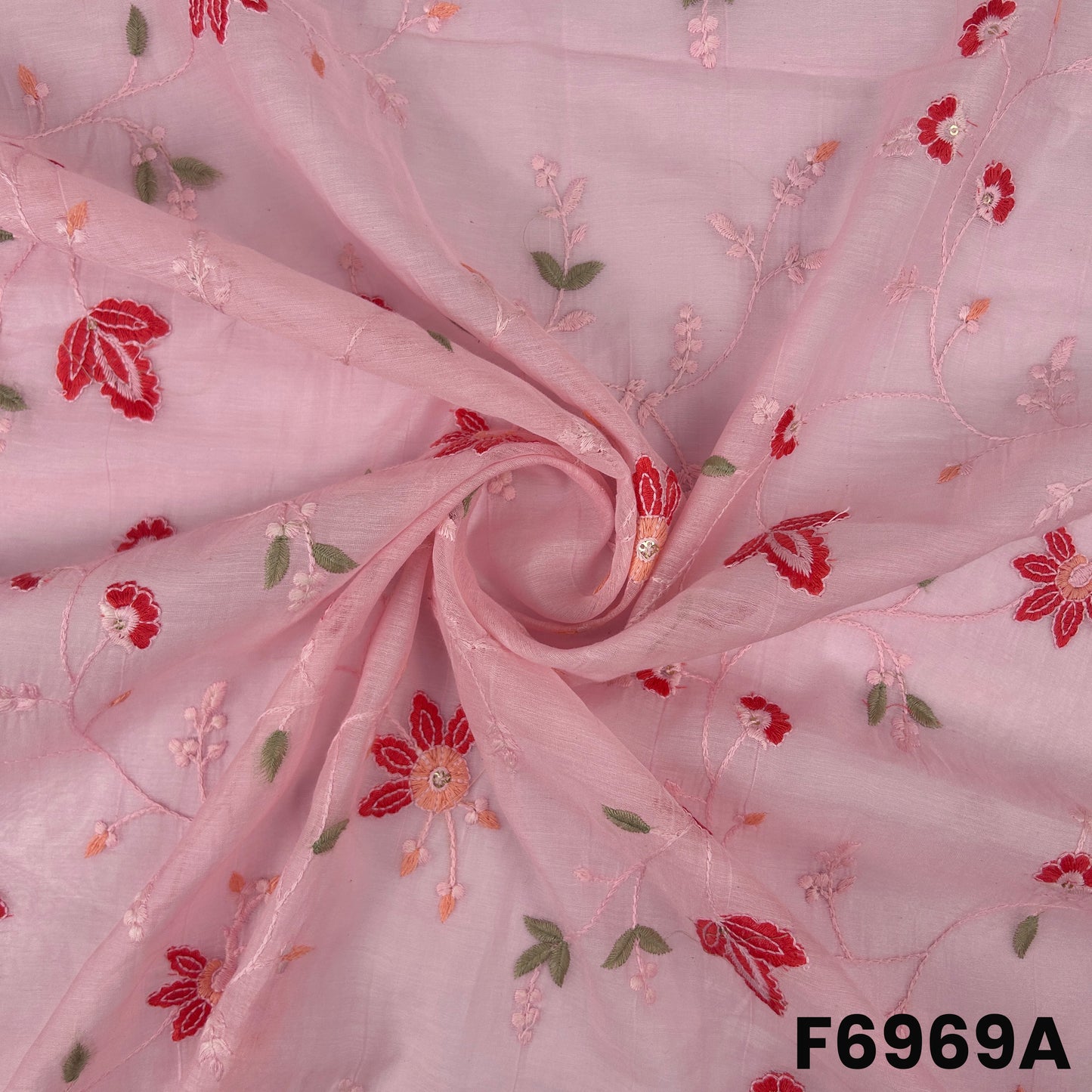 Close view of F6969A showing red flower motifs, sage green leaves and gentle shimmer on airy Chanderi texture