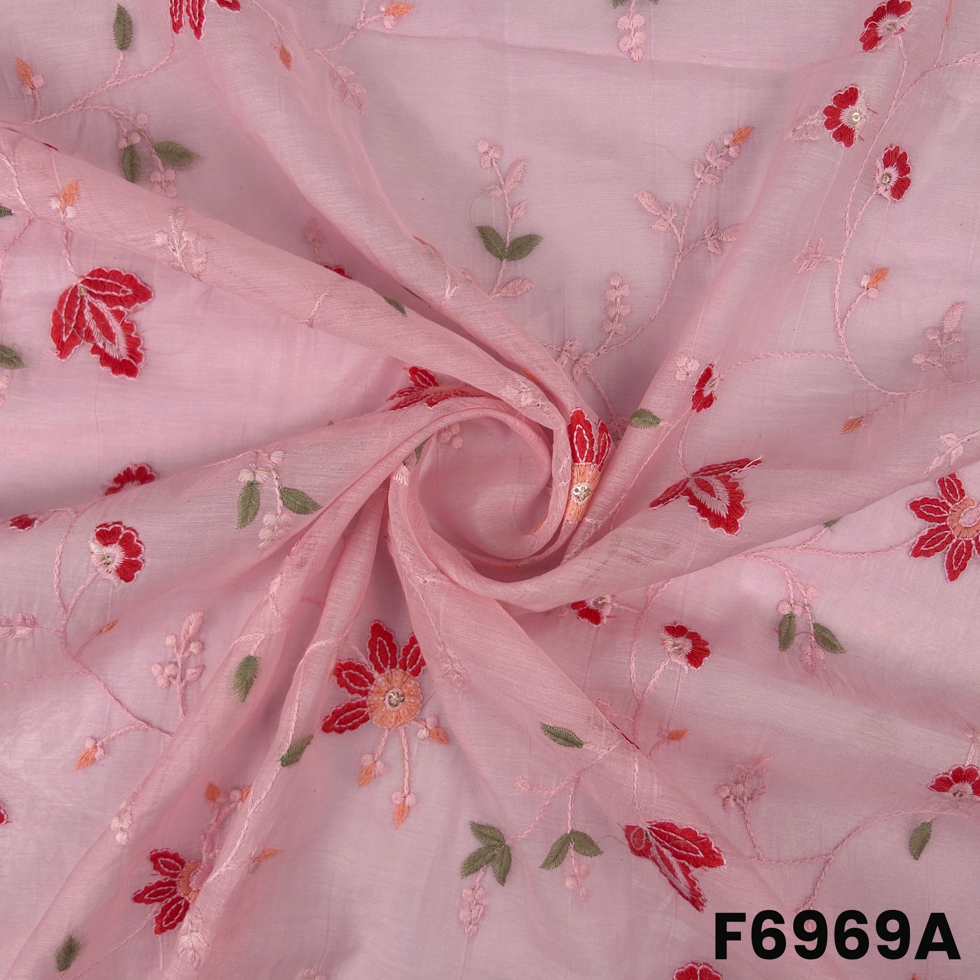 Close view of F6969A showing red flower motifs, sage green leaves and gentle shimmer on airy Chanderi texture