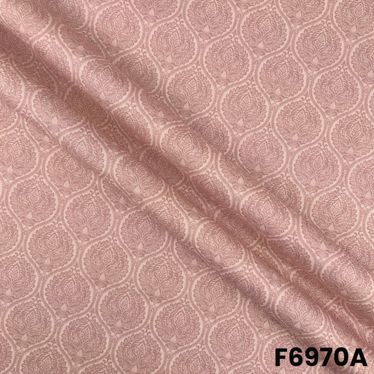 Close view of F6970A showing delicate printed motifs, smooth folds and natural linen-style texture