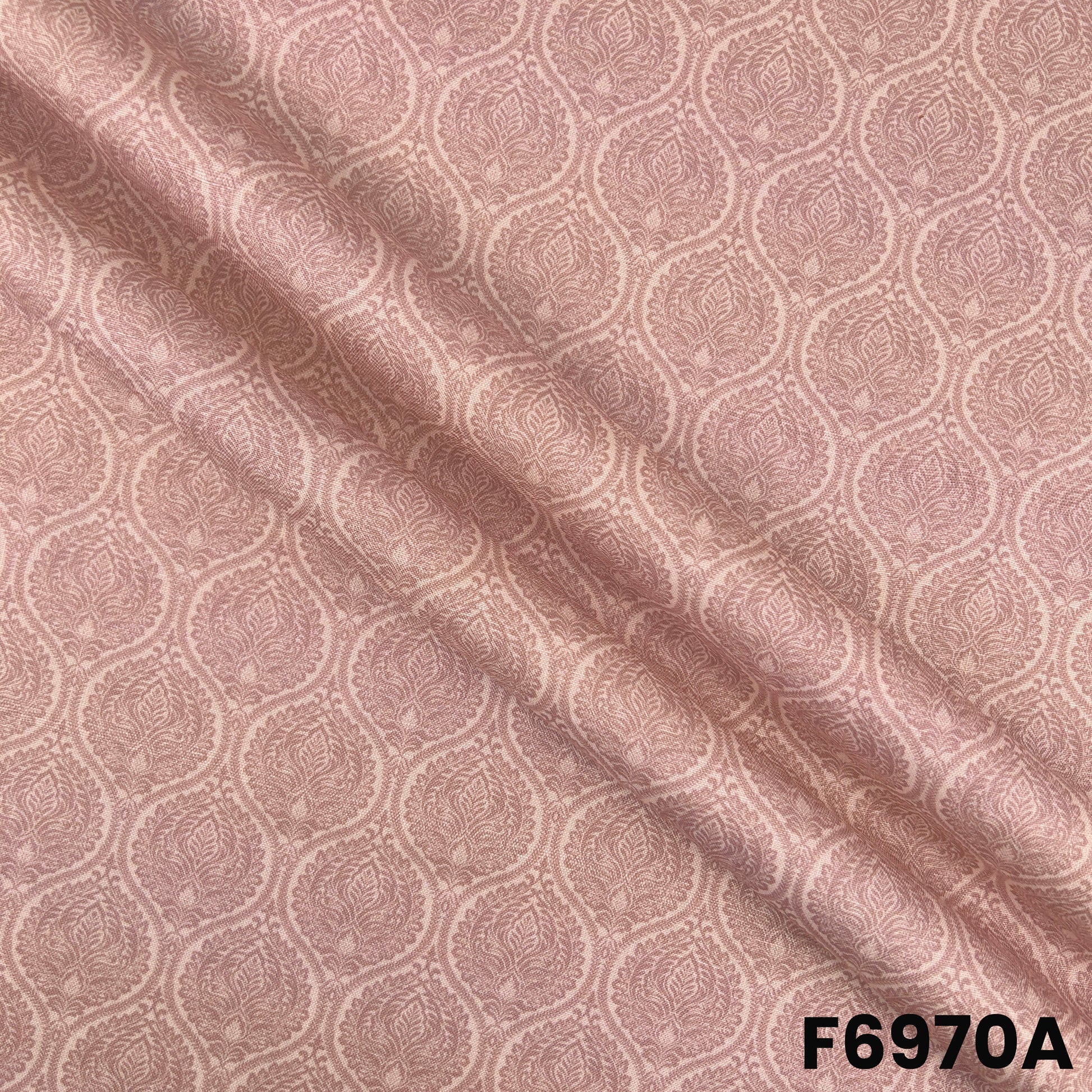 Close view of F6970A showing delicate printed motifs, smooth folds and natural linen-style texture