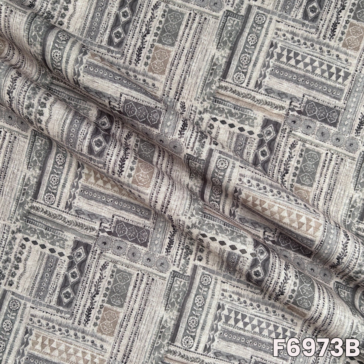 Detailed F6973B view highlighting fine motif placement, breathable woven feel and graceful drape