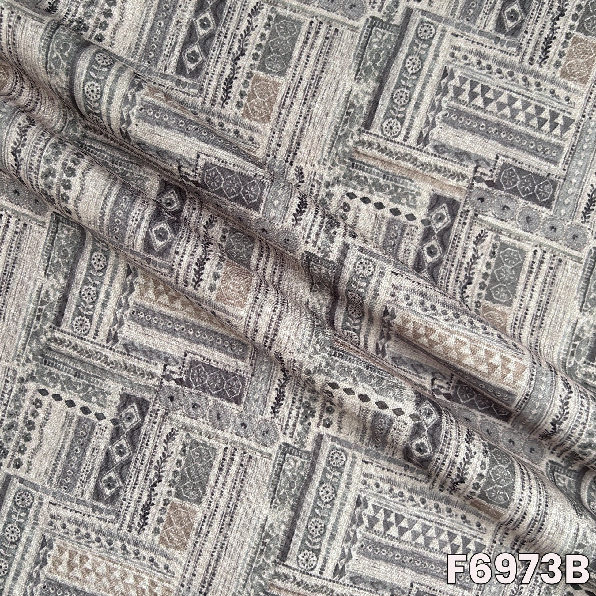 Detailed F6973B view highlighting fine motif placement, breathable woven feel and graceful drape