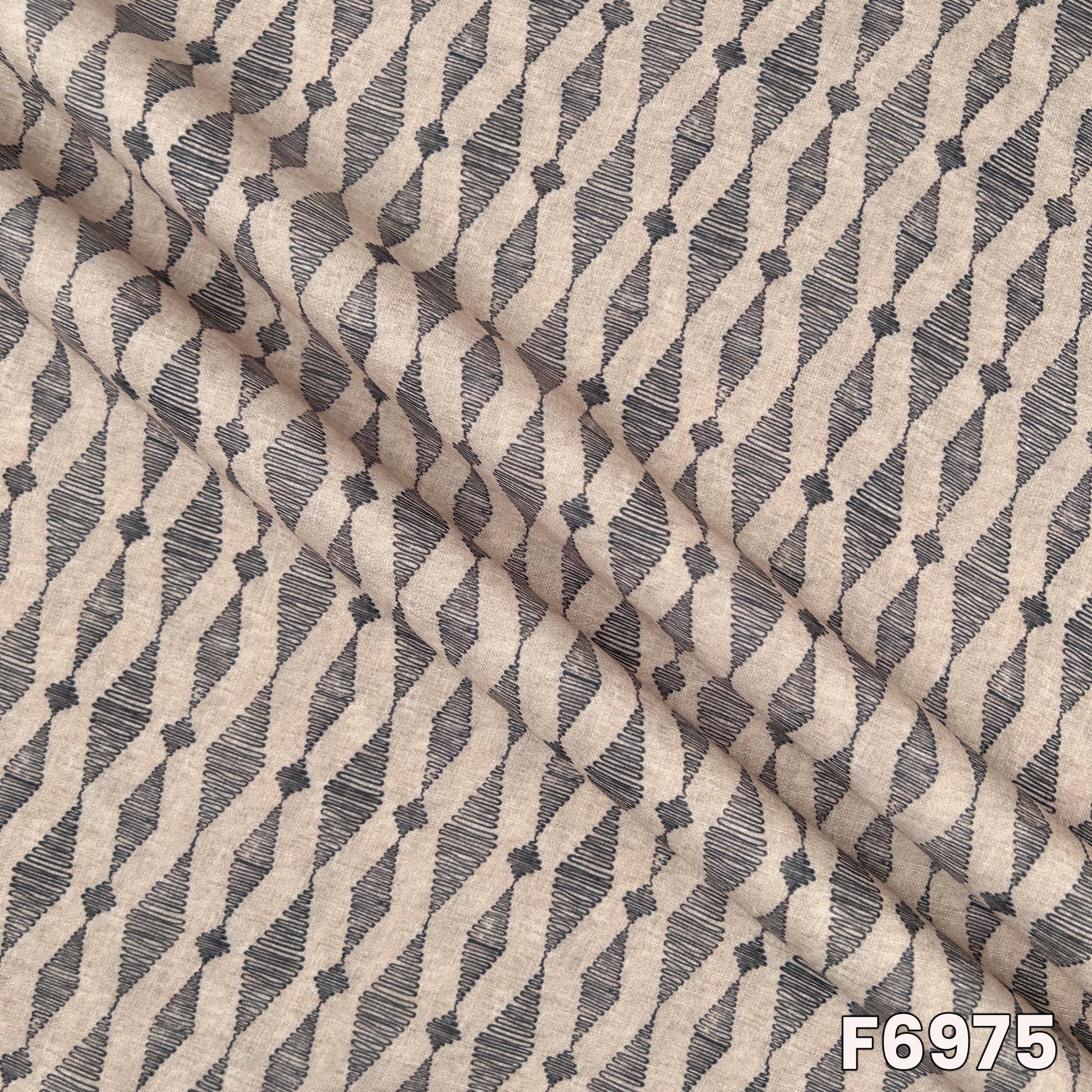 Draped F6975 semi linen fabric highlighting soft folds, natural beige tone and contemporary print finish
