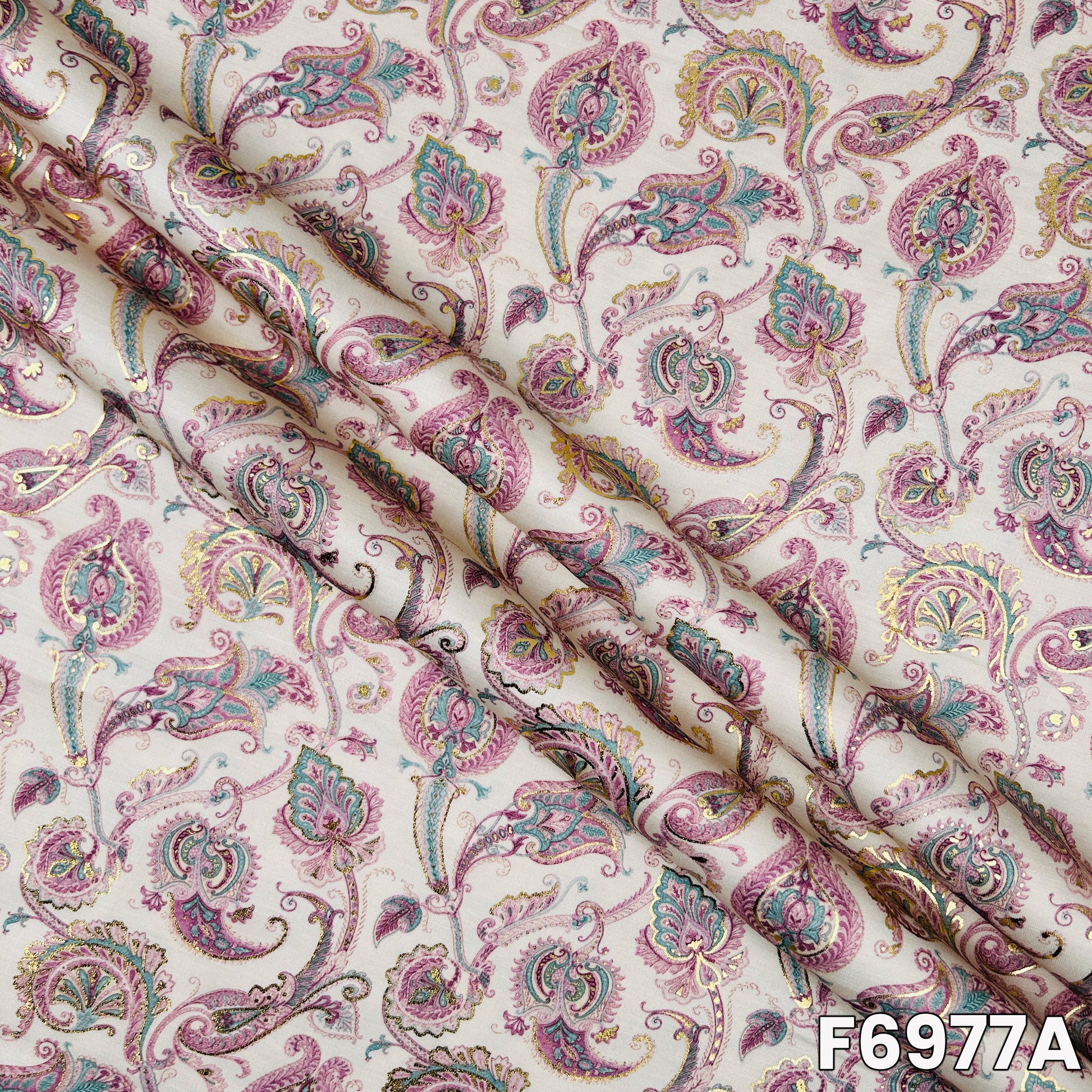 Close view of F6977A showing pastel paisley artwork, soft folds and graceful foil detailing
