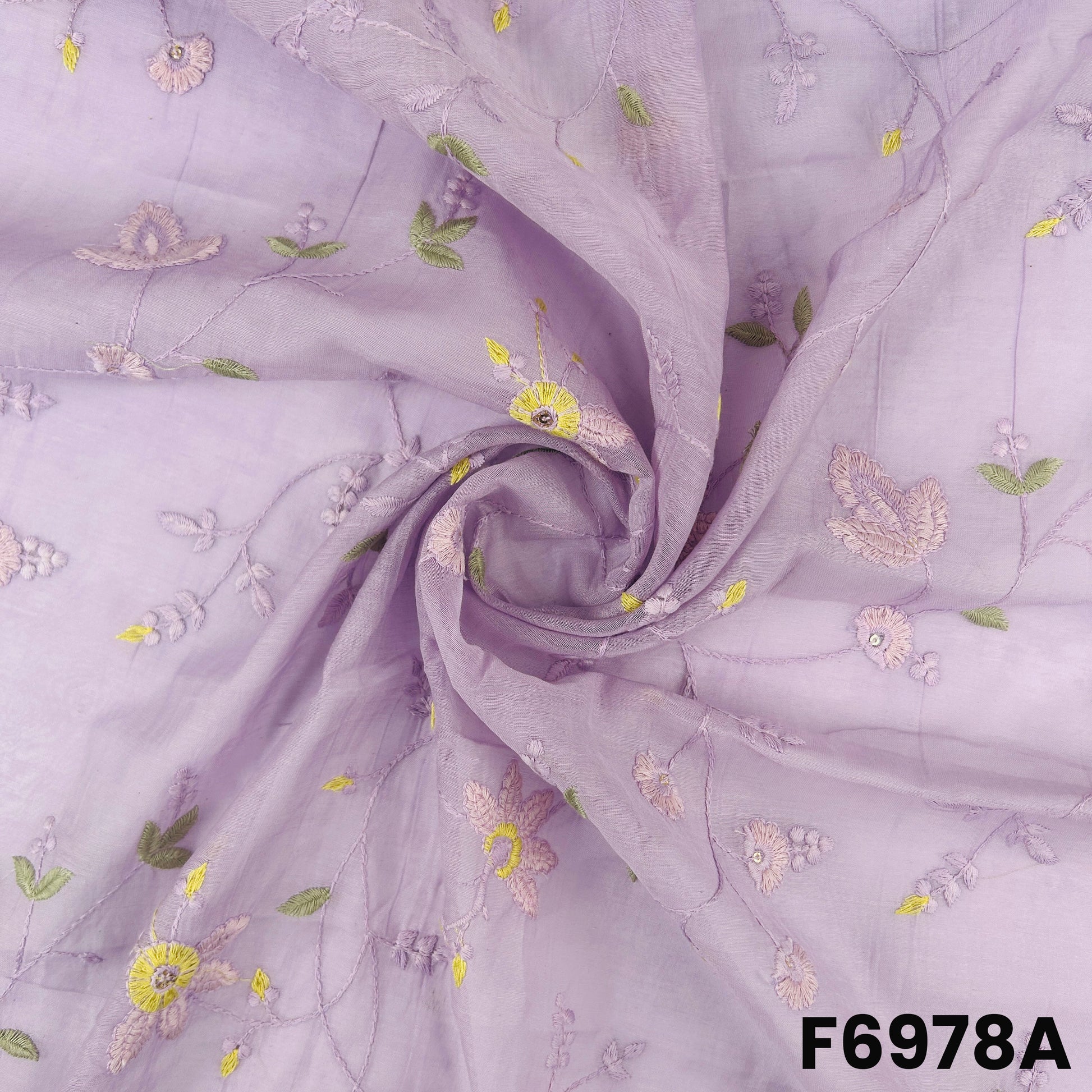 Close view of F6978A showing pastel purple folds, fine floral threadwork and gentle shimmer accents