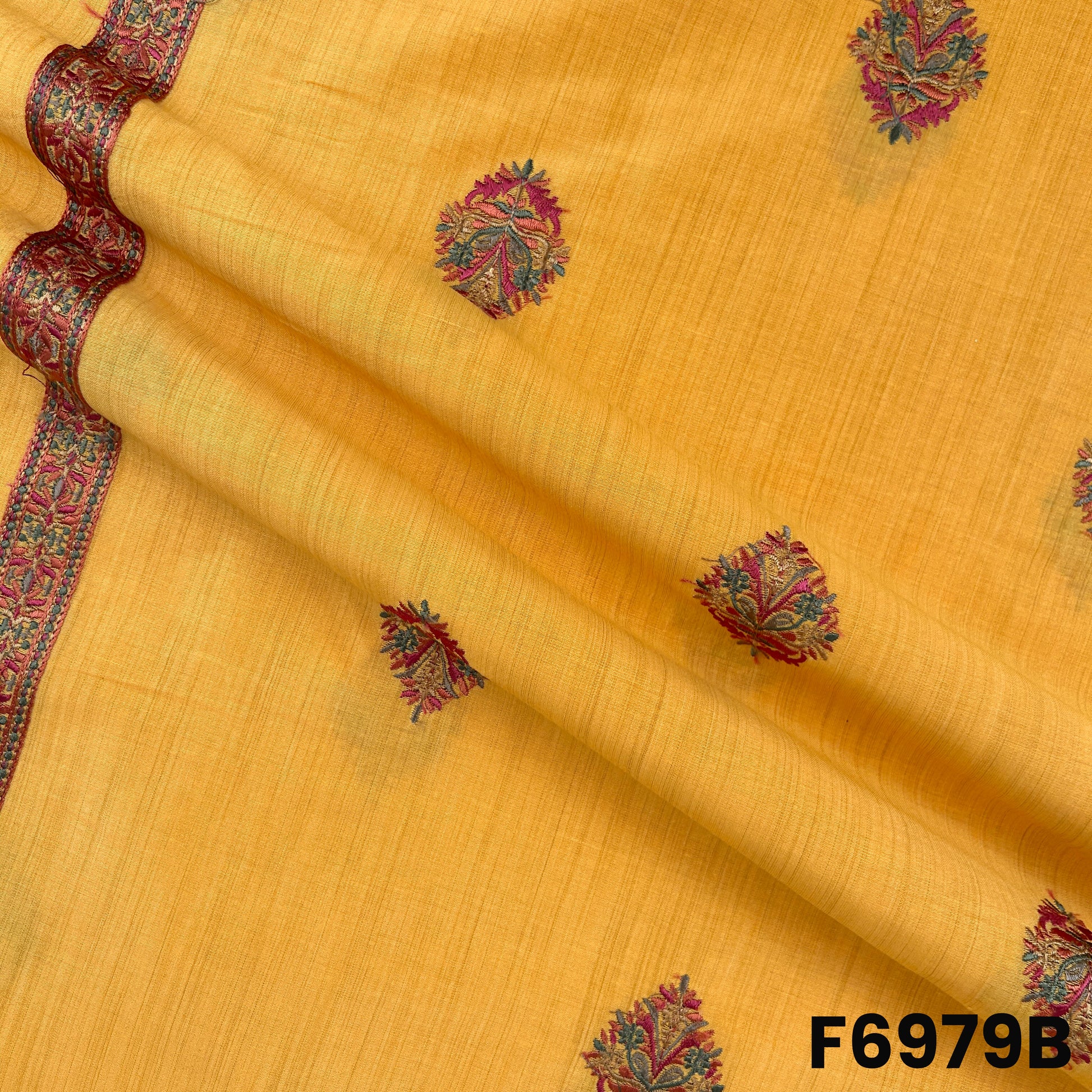 Draped F6979B fabric highlighting rich yellow tone, embroidered buta work and graceful semi silk texture