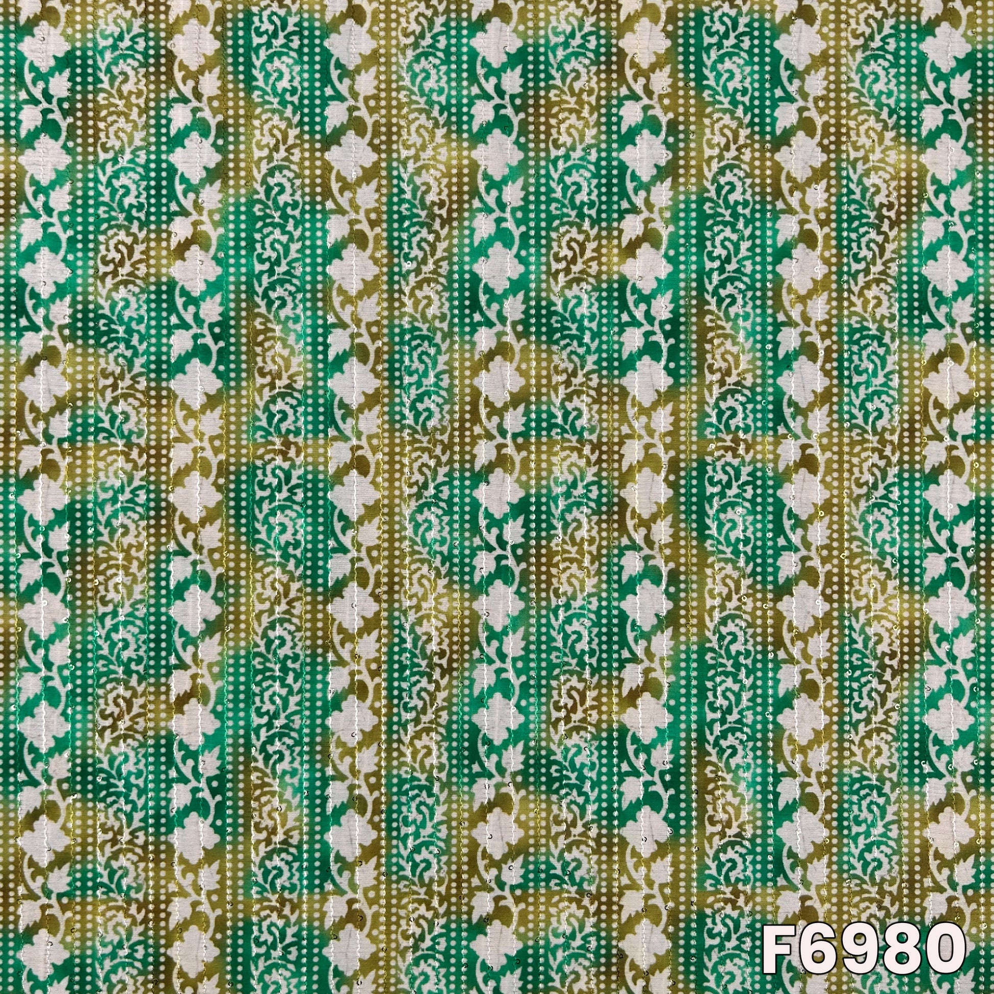 Close pattern view of F6980 showing vertical floral stripes, ornate borders and subtle sequins accents